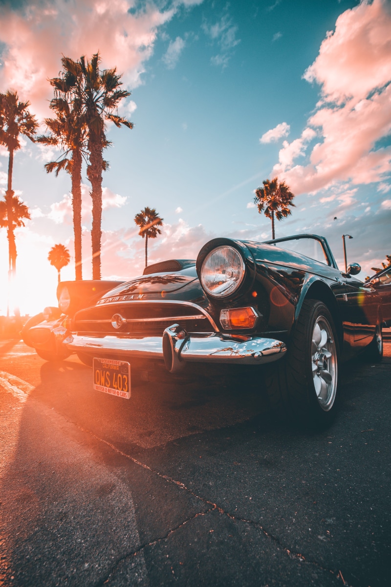 retro, orange color, outdoors, tree, motor vehicle, city, sign, photo, tropical climate, mode of transportation, transportation, sunset, road, land vehicle