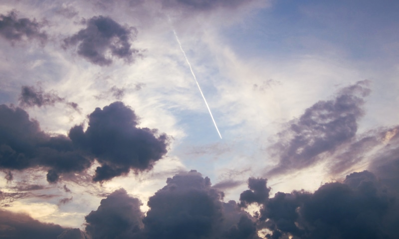 sunlight, low angle view, sunset, beauty in nature, vapor trail, heaven, tranquil scene, tranquility, scenics - nature, gray, full frame, cloudy, cloud - sky