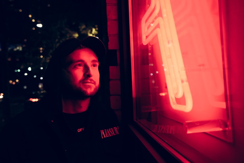 one person, black, technology, dj, lighting, real people, young men, text, indoors, lifestyles, window, nightlife, time, signage, night, night life, forge