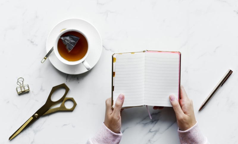 pen, table, relax, paper, cup, blank, work space, composition, drink, hot drink, near, diary, crockery, workplace, coffee, human hand, person, scissors