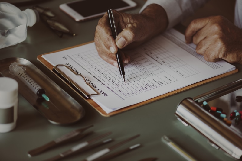 paper, human body part, hospital, diagnosis, note pad, real people, application, english, america, closeup, finger, men, information, publication, care