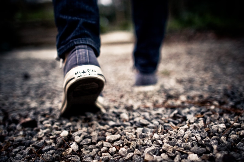 close-up, lifestyles, one man only, walking, feet, jeans, walking on, people, rock, Converse, body part, shoes, blur, male, limb, human foot, casual clothing