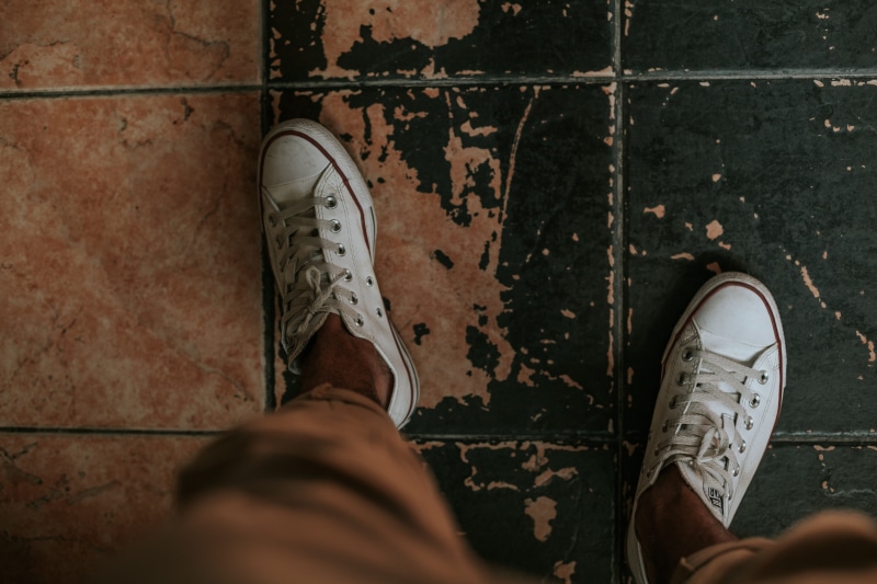 feet, selective focus, human limb, human leg, tiled floor, jeans, standing, human body part, shoe, converse, white converse shoes, star, footwear, men
