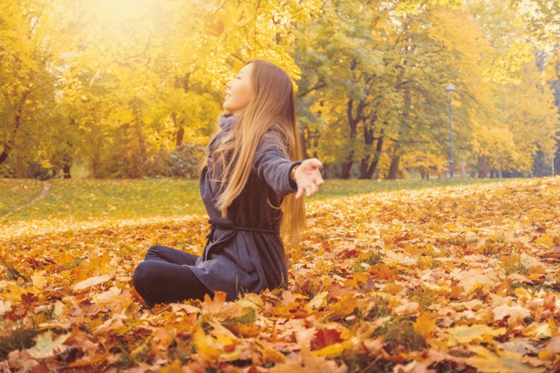 women, day, plant, tree, plant part, outdoors, hairstyle, hair, clothing, park, adult, leisure activity, change, sitting, leaves, nature, real people, one person