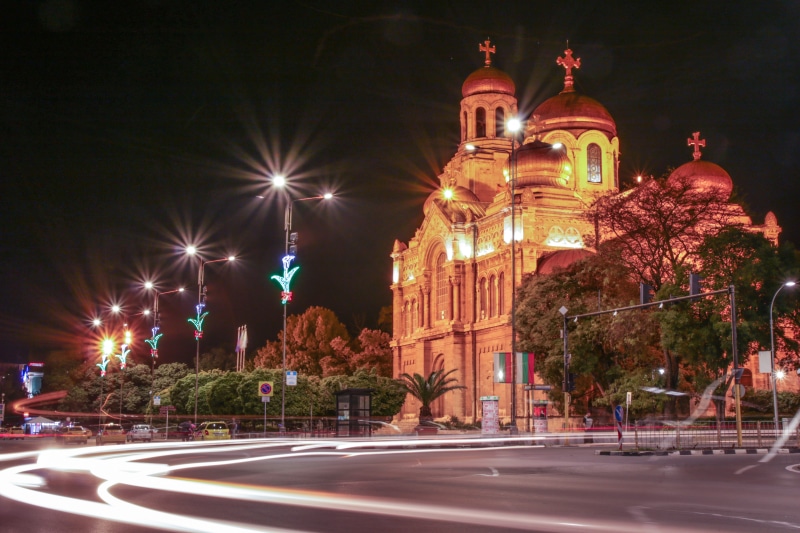 city, traffic lights, long exposure, road, light, motion, architecture, night, street light, religion, no people, cathedral, built structure, illuminated