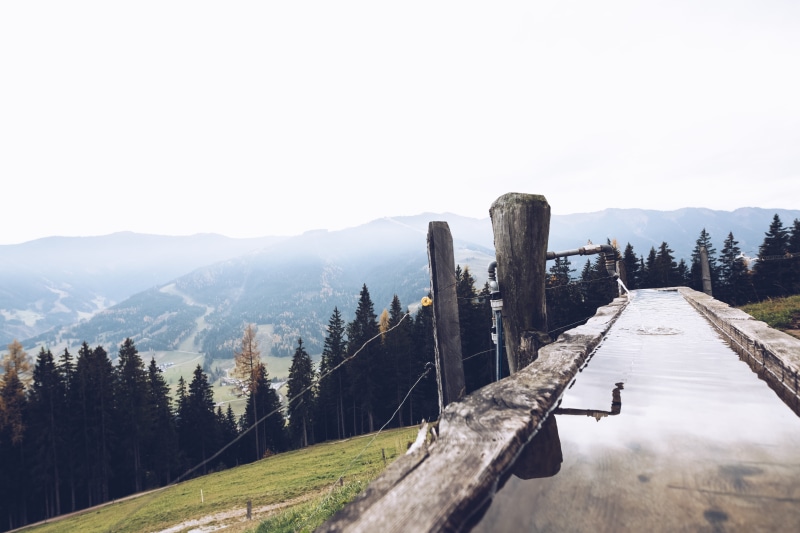 clear sky, environment, pathway, copy space, wood, view, brown, sky, tranquil scene, alpine pasture, wood - material, top, tree, day, outdoors, mountain pasture