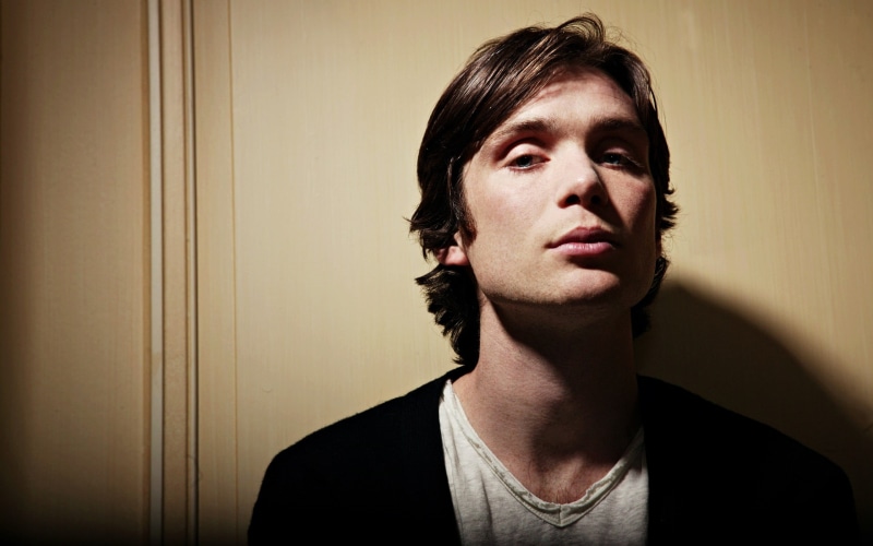 neck, 2K, dark-haired, studio Shot, mid adult, caucasian Ethnicity, cillian murphy, staring, adults Only, home interior, gray, color Image, one Young Man Only