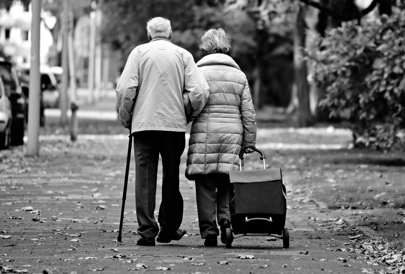 two people, women, senior adult, full length, together, positive emotion, day, bonding, care, senior couple, walking cane, walking stick, arm around, two