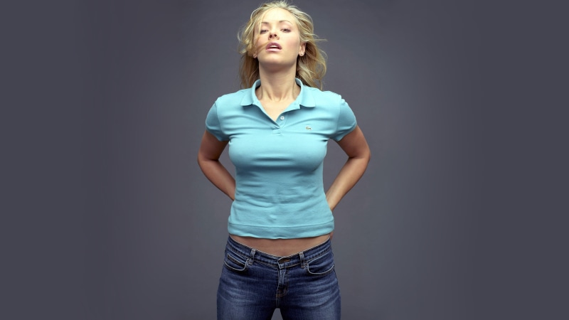studio shot, shirt, hairstyle, Kristanna Loken, portrait, standing, blue, 5K, jeans, blonde, three quarter length, beautiful woman, actress, casual clothing