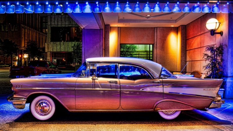 illuminated, no people, building exterior, pink, outdoors, street, architecture, purple, garage, built structure, land vehicle, lighting equipment, luxury