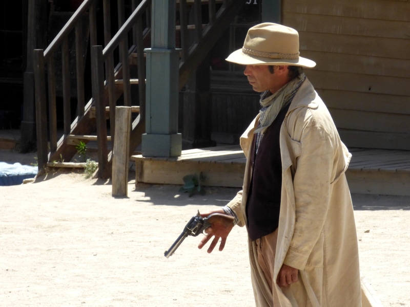 standing, wild, built structure, far west, man, hollywood, 2K, film, architecture, men, profile view, one person, revolver, pistol, gun, adult, side view
