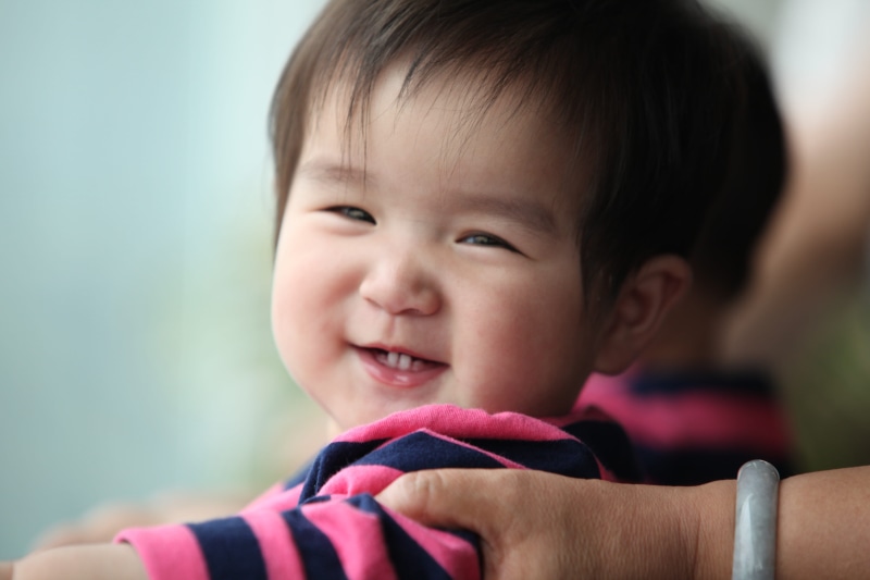 one Person, innocence, focus on foreground, little, macro shot, shot, shirt, young, chinese Ethnicity, smile, 5K, person, baby boy, small, black, headshot