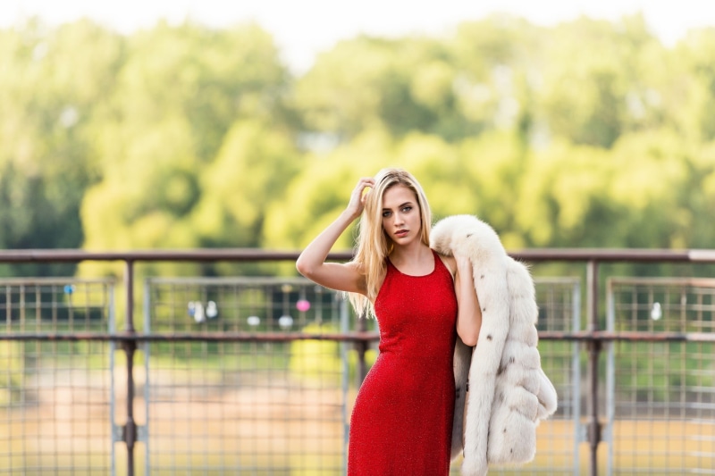 young adult, hairstyle, white, fur coats, young women, beauty, red dress, outdoors, depth of field, bodycon, focus on foreground, clothing, front view