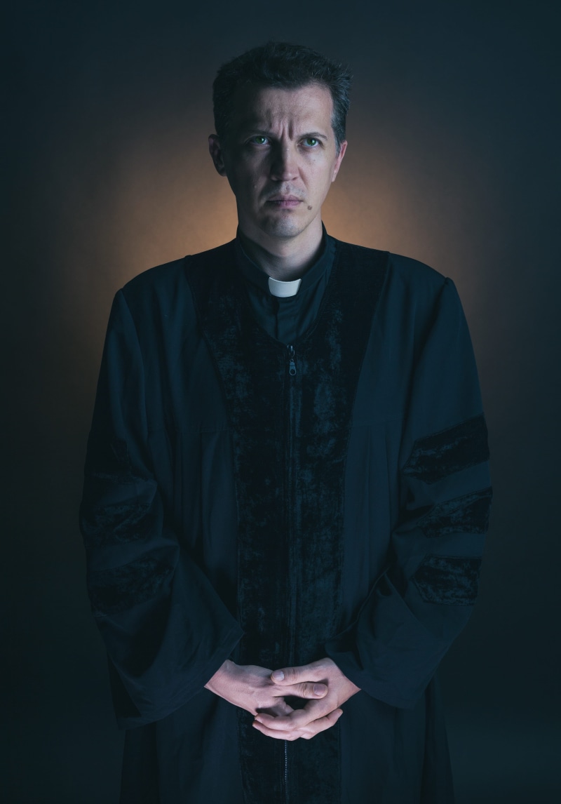 front view, clothing, young adult, young men, 5K, three quarter length, angry, priest, hairstyle, serious, adult, looking at camera, dramatic, teenager