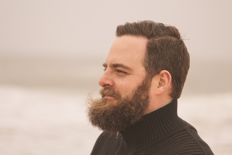 person, neck, men, beard, mid adult, field, candid, pensive, daylight, hairstyle, black, human face, contemplation, focus, man, fine-looking, profile, close-up