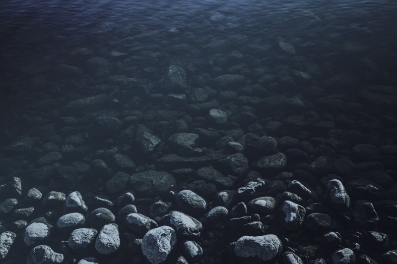 large group of objects, black, rock, abundance, solid, stone, lot, 720P, shallow, beach, pebble, high angle view, fragment, day, tranquility, stone - object