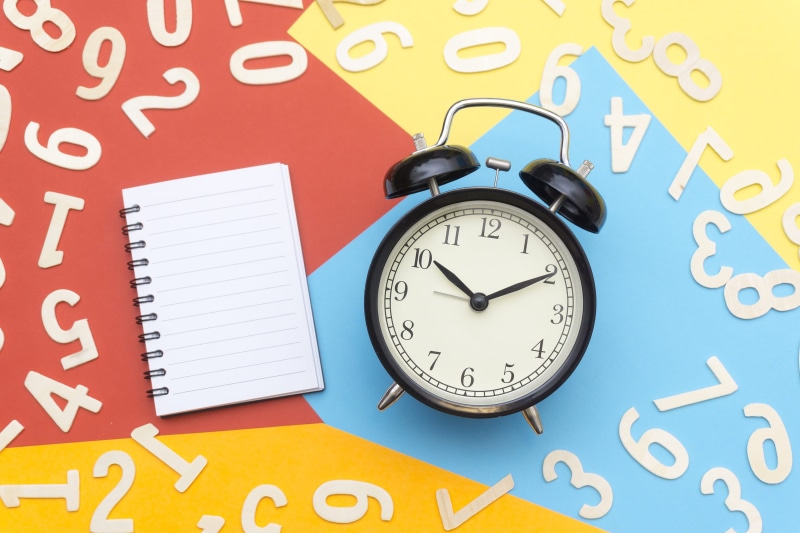 notebook, alarm clock, numbers, background, no people, reminder, indoors, creative, number, page, alert, alarm, minute, communication, book, surface, lying