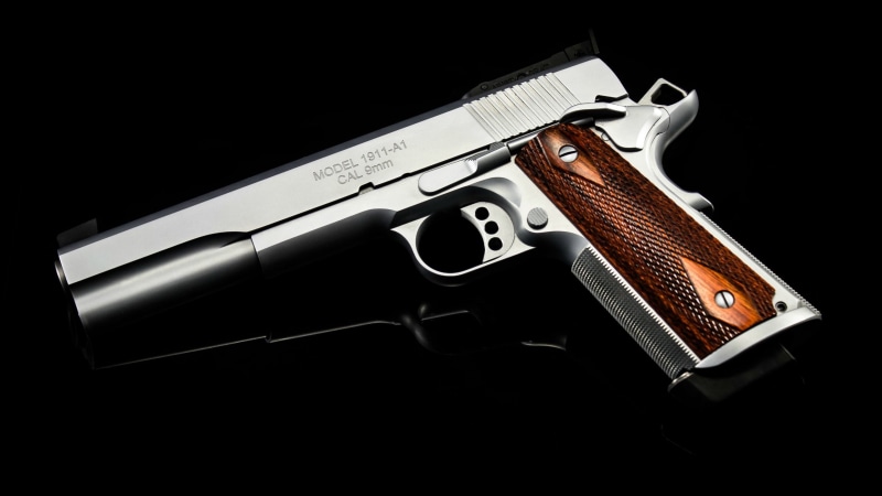 handgun, aggression, black background, sign, crime, weapon, indoors, 2K, M1911, still life, violence, social issues, ammunition, pistol, single object