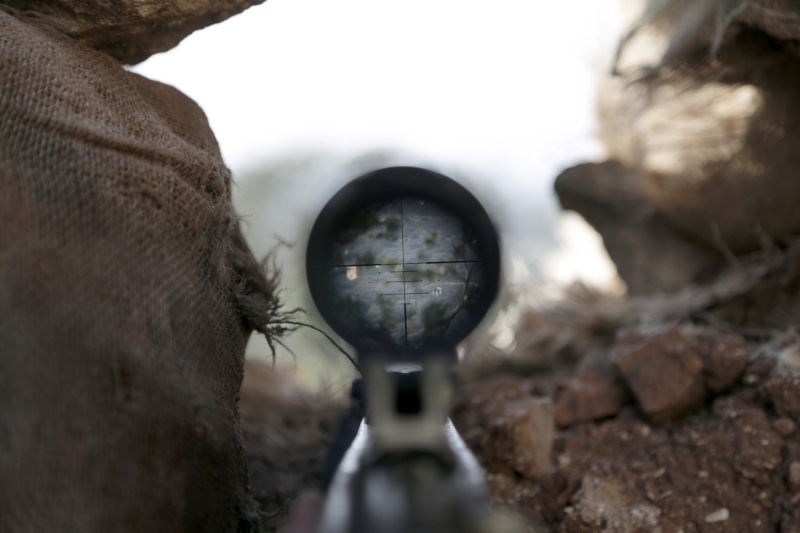 reflection, real people, outdoors, guns, close-up, gun, solid, focus on foreground, weapon, technology, day, assault, military, sky, rock - object, rock