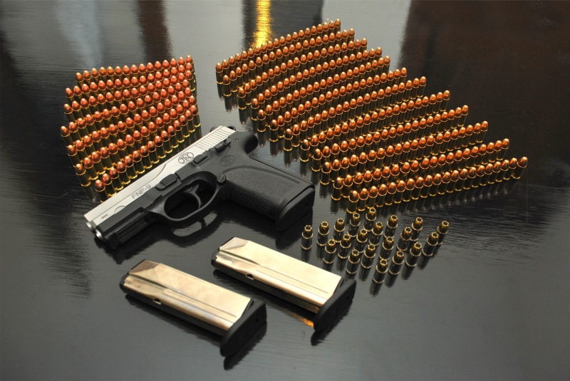 black, gun, high angle view, handgun, studio shot, stack, social issues, close-up, pistol, no people, food and drink, safety, wooden, indoors, ammunition