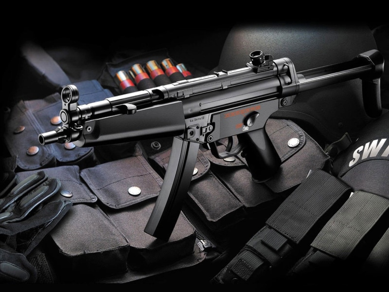 communication, close-up, aggression, arts culture and entertainment, black color, 1080P, violence, machine gun, still life, music, Weapons, indoors, handgun
