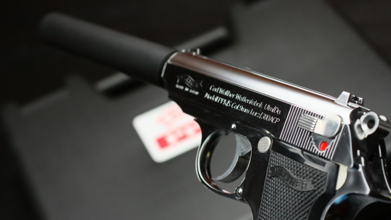 western script, technology, weapon, black, close-up, pistol, government, home video camera, Walther PPK, arts culture and entertainment, text, selective
