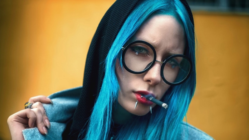 smoking, close-up, teenager, eyeglasses, piercing, glasses, women, focus on foreground, 1080P, hoodie, studio shot, pullover, hair, holding, front view