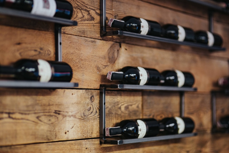 in a row, Interior, still life, wine, wine Rack, large group of objects, selective focus, cellar, indoors, wood - Material, wine Bottle, arrangement, refreshment