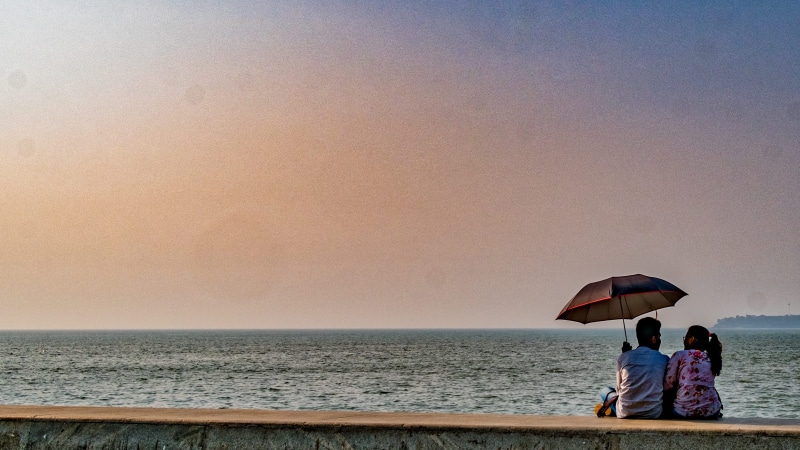 horizon over water, beach, women, rear view, leisure activity, outdoors, protection, lifestyles, couple, marine drive, horizon, quay, togetherness, water