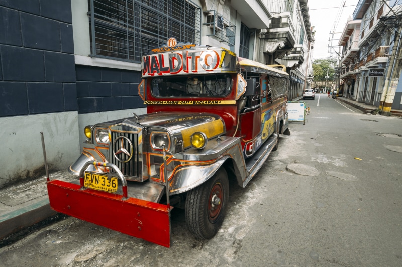 van, built structure, outdoors, transportation, motor vehicle, truck, bus, city street, street, mode of transportation, architecture, jeepney, city life