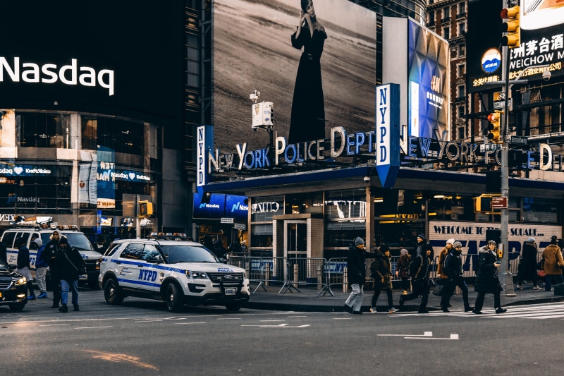 mode of transportation, new york, real people, walking, urban, built structure, road, city, text, police, near, city street, transportation, group of people