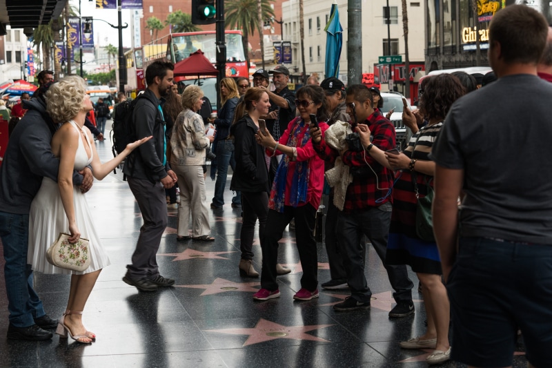 day, adult, crowd, group of people, leisure activity, people, men, hollywood boulevard, transportation, walking, city, women, building exterior, outdoors