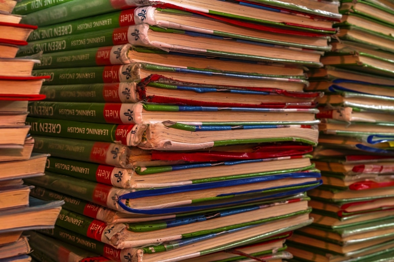large group of objects, used books, spine, books pile, information, publication, multi colored, in a row, arrangement, old books, book collection, retail