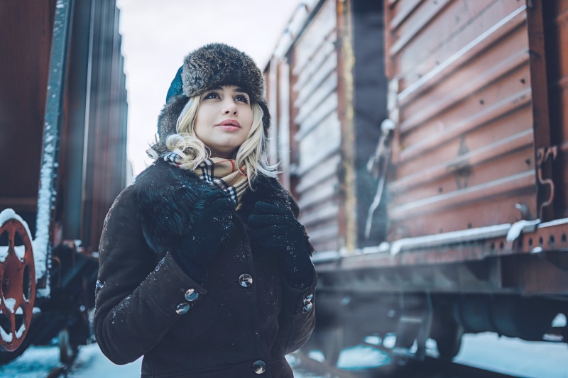 brown, pants, human, beautiful woman, leisure activity, coat, scarf, lifestyles, knit, black, footwear, fashion, fur, building exterior, portrait, built structure