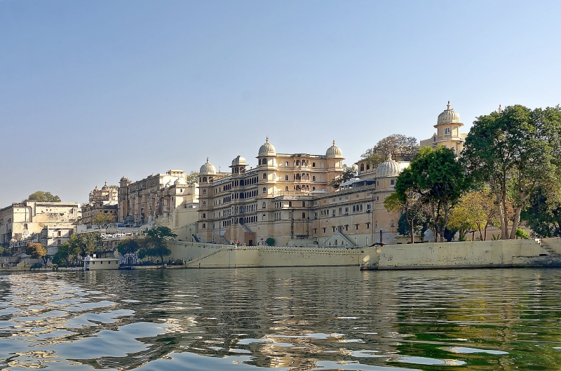 places of interest, plant, place of worship, architecture, building, clear sky, spirituality, tree, nature, lake pichola, outdoors, travel destinations