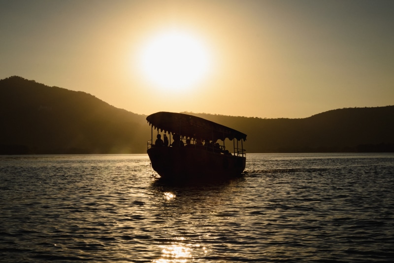 sunlight, passenger craft, mountain, scenics - nature, outdoors, silhouette, nature, sky, lake, transportation, orange, rajasthan, boat, tranquility, sea
