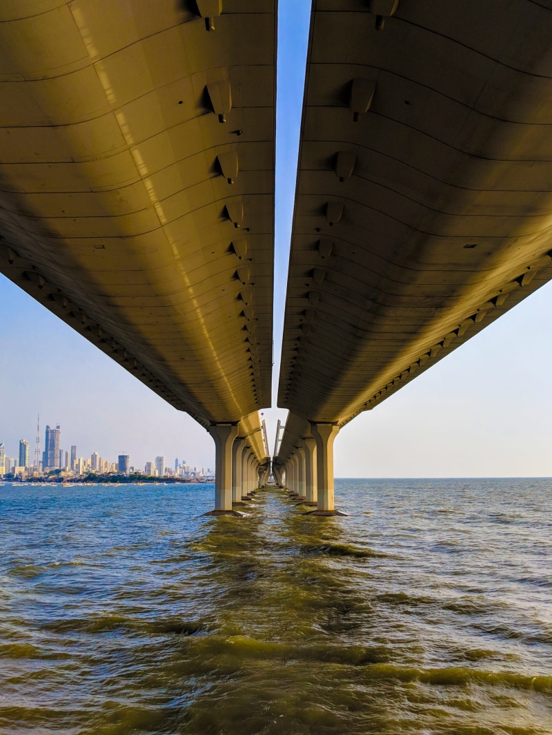 transportation, built structure, building exterior, nature, city, sky, skyscraper, 2K, underneath, river, engineering, water, architectural column, outdoors