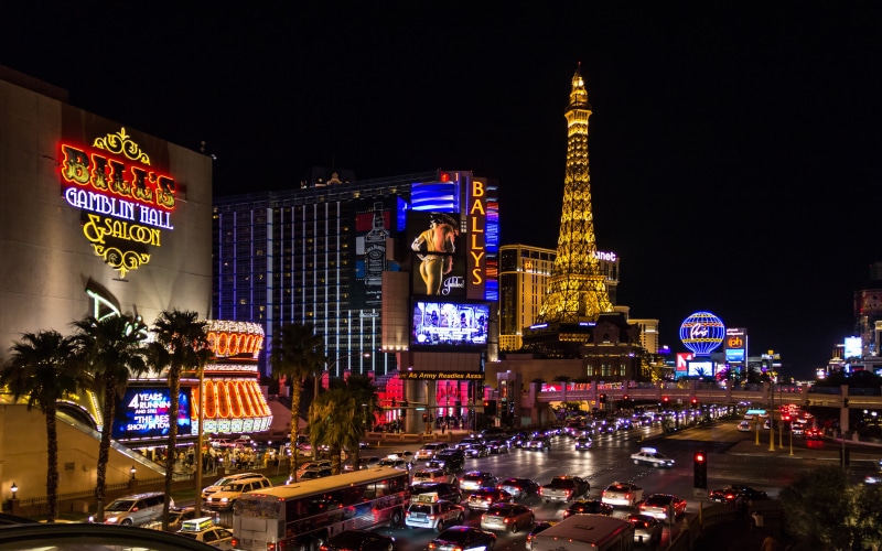 representation, communication, strip, nevada, male likeness, tower, human representation, building, text, building exterior, city life, office building exterior