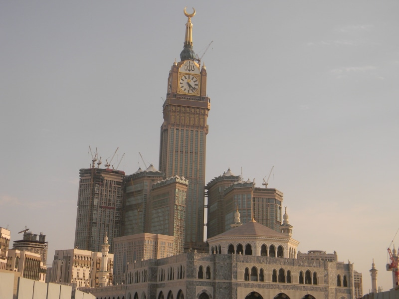 office building exterior, spire, clock, nature, travel destinations, built Structure, al abrar mecca, outdoors, 2K, urban Scene, architecture, cityscape