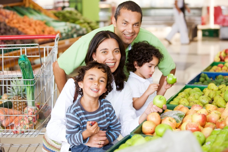 portrait, people, boy, daughter, standing, looking, apple - Fruit, consumerism, buying, orange - Fruit, happiness, shelf, smiling, fruit, food and drink