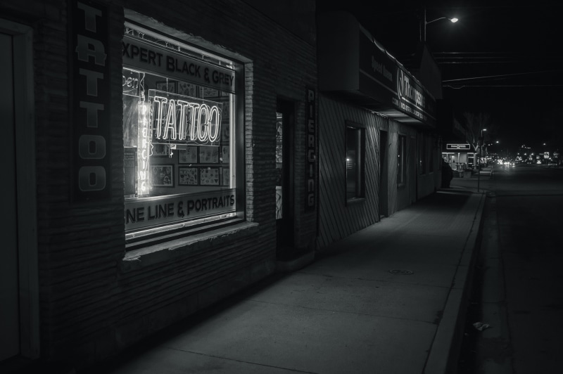 the way forward, black-and-white, glass window, tattoo shop, tattoo, footpath, sign, no people, travel, city, shop, building, illuminated, 5K, street