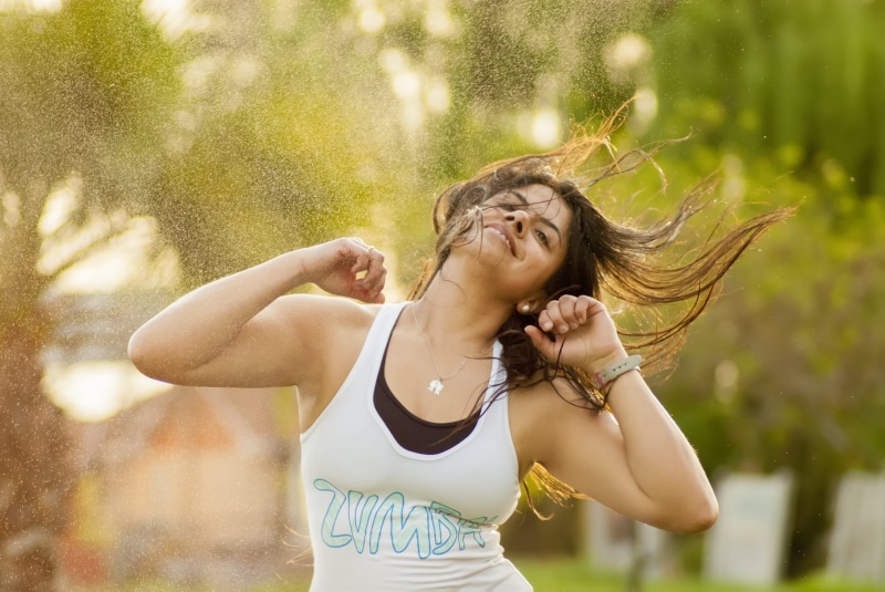 dance, tank, adults only, beautiful woman, day, human arm, young women, near, emotion, women, hair toss, human hair, exercise, arms raised, sport, party