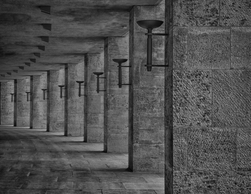 architectural column, wall, construction, built structure, concrete, direction, columns, wall - building feature, torch, stones, old, arcade, vintage, black and white