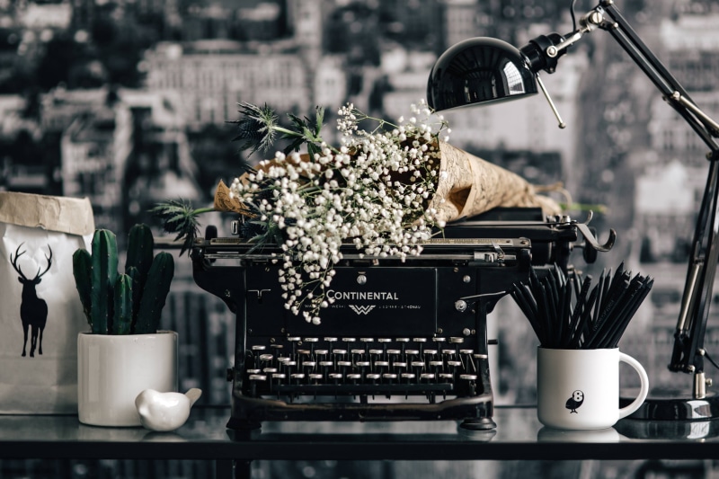 no people, vintage, flower head, vase, old, freshness, indoors, laptop, nature, typewriter, close-up, coffee - Drink, cyrylic, table, cup, writer, food
