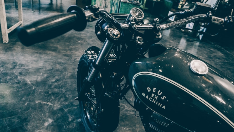 motorbike, focus on foreground, vintage, indoors, engine, military, technology, still life, sport, land vehicle, deus ex machina - temple of enthusiasm