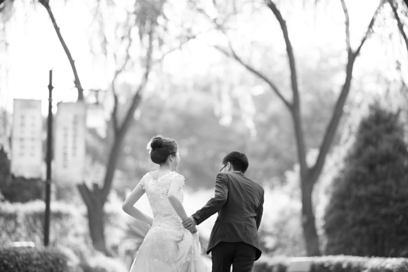 lifestyles, two people, men, real people, plant, rear view, leisure activity, love, women, outdoors, tree, event, togetherness, newlywed, positive emotion