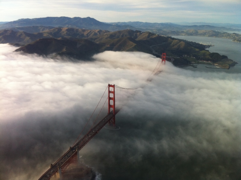 sky, fog, beauty in nature, high angle view, nature, architecture, no people, built structure, mountain, building exterior, aerial view, environment, day