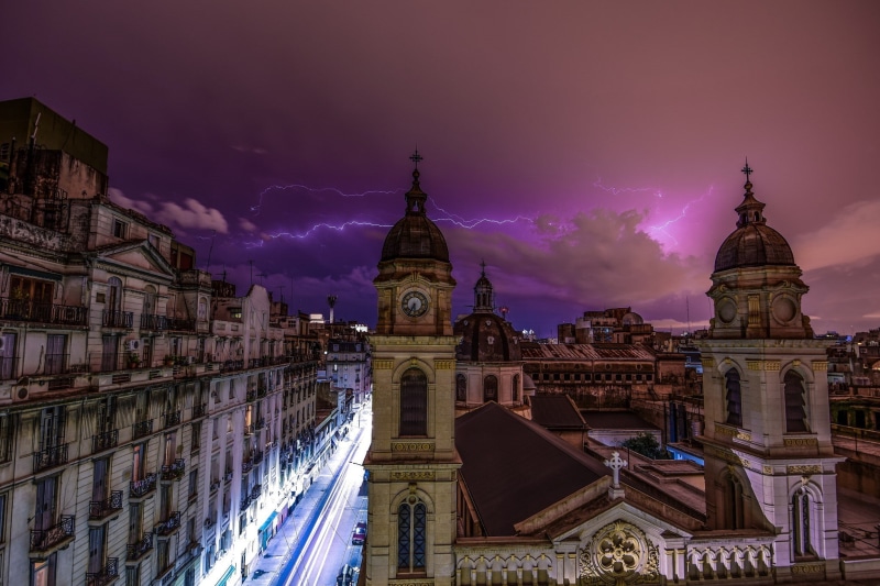 sky, travel destinations, nature, no people, purple, tourism, built structure, history, cloud - sky, place of worship, illuminated, city, tower, religion