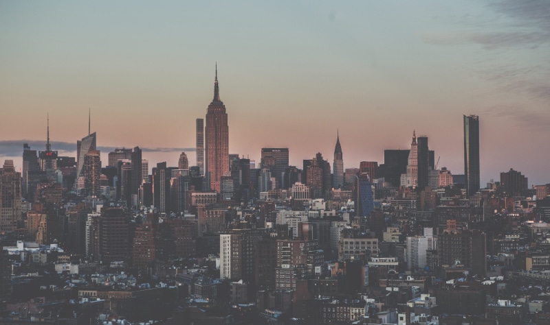 travel destinations, nyc, skyline, office building exterior, outdoors, crowd, city, built structure, moody, landscape, modern, cityscape, spire, dark, tall - high
