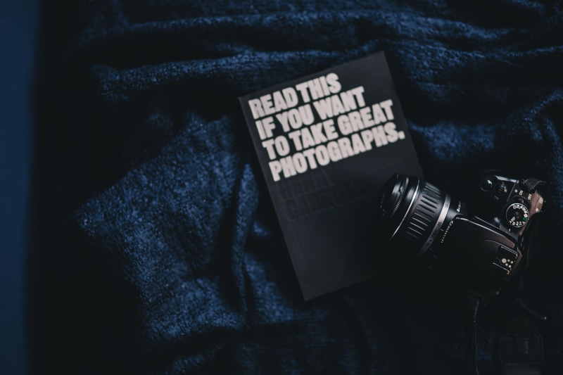 focus on foreground, book, canon 400d, directly above, refreshment, arts culture and entertainment, camera, still life, no people, blue, DSLR Camera, table
